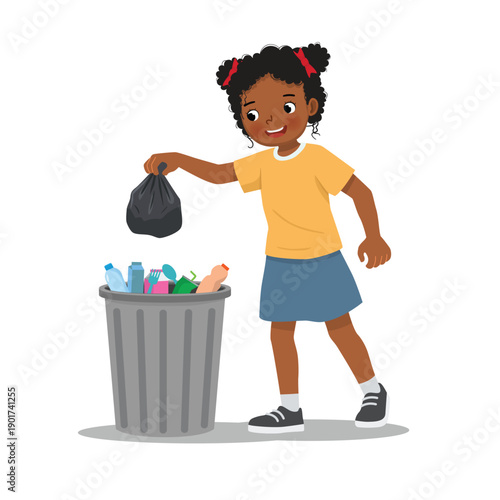 Little African girl throwing trash into recycle bin
