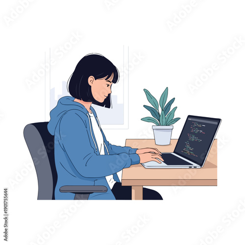 Woman sitting at a desk working on a laptop