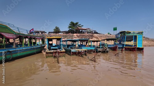 Cruising past boats near the floating village of Kampong Phluk in Cambodia.