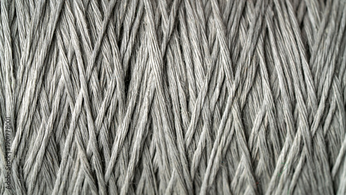 Close-up of a spool of gray yarn