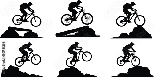 Black silhouettes of mountain biker performing stunts on rocks