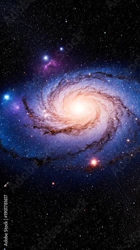 Wallpaper Mural A vibrant spiral galaxy, stars pepper a deep space backdrop, illuminated center and starry expanse Torontodigital.ca