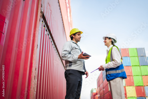 Fotografie Professional logistics team stopping to review information and discuss work