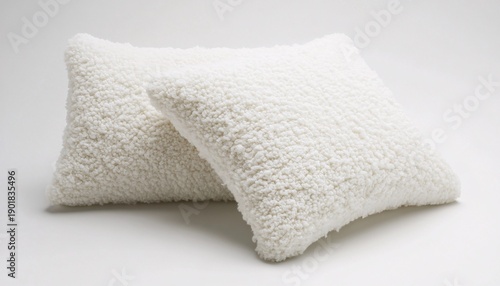 Soft textured white pillows creating a cozy atmosphere of comfort relaxation and modern home simplicity