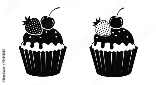 Two black and white cupcakes decorated with cherries and strawberries