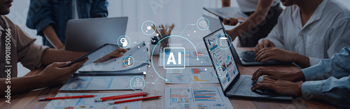 Tableau sur toile Diverse team works together on an artificial intelligence project, utilizing laptops and documents to explore data, generate ideas, and foster innovative solutions