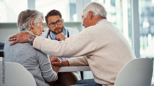 Tableau sur toile Comfort, senior couple and doctor in consultation, cancer diagnosis and empathy for medical condition