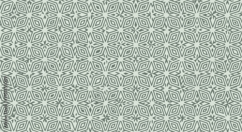 Intricate geometric pattern of repeating star and diamond shapes in a soft sage green color for a sophisticated background.