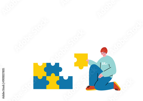 パズルを組み立てる男性