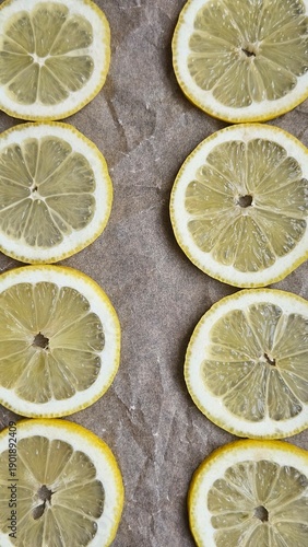 Lemon slices pattern on parchment paper background