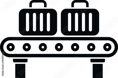 Travel suitcases standing on a baggage claim conveyor belt in an airport terminal