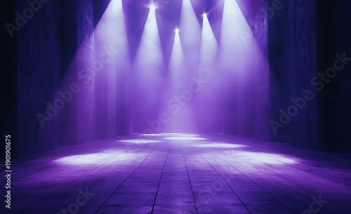 Empty stage illuminated with purple spotlights, creating a dramatic atmosphere