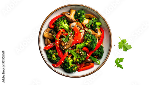Bowl of colorful vegetables, including broccoli, peppers, and mushrooms, sits isolated