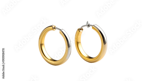 Two gold and silver hoop earrings, glossy finish, isolated on black