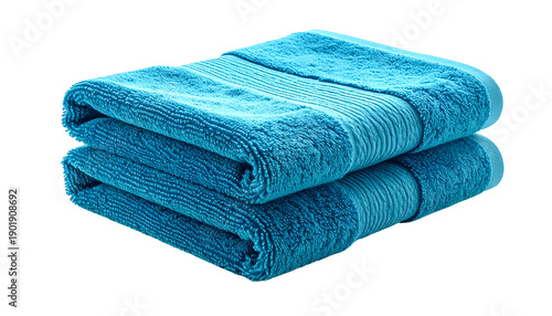 Two folded turquoise bath towels, stacked and isolated on black