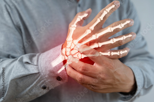 Hand and Wrist Pain with Bone Anatomy Highlighted for Medical and Arthritis Concept