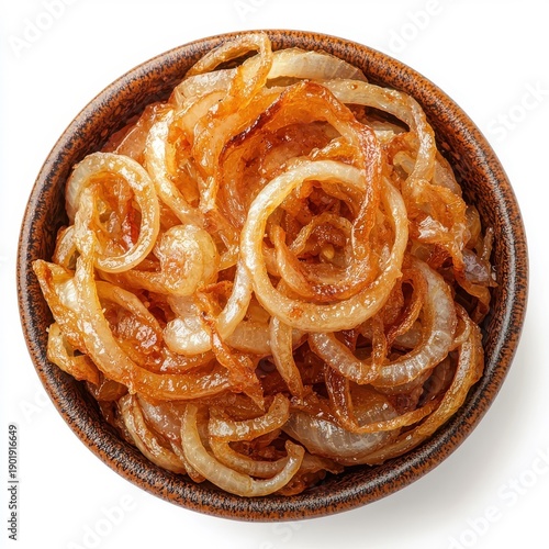 Fried onions placed on a plate, isolated on a white background, garnished to enhance their appealing look and deliciousness.