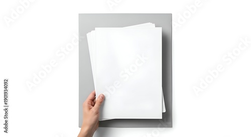Human Hand Holding Stack Of White Paper Sheets On Gray Background