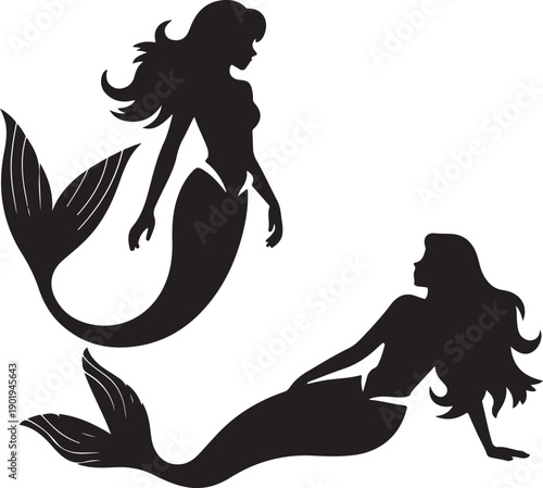 two mermaids in silhouette swimming in water