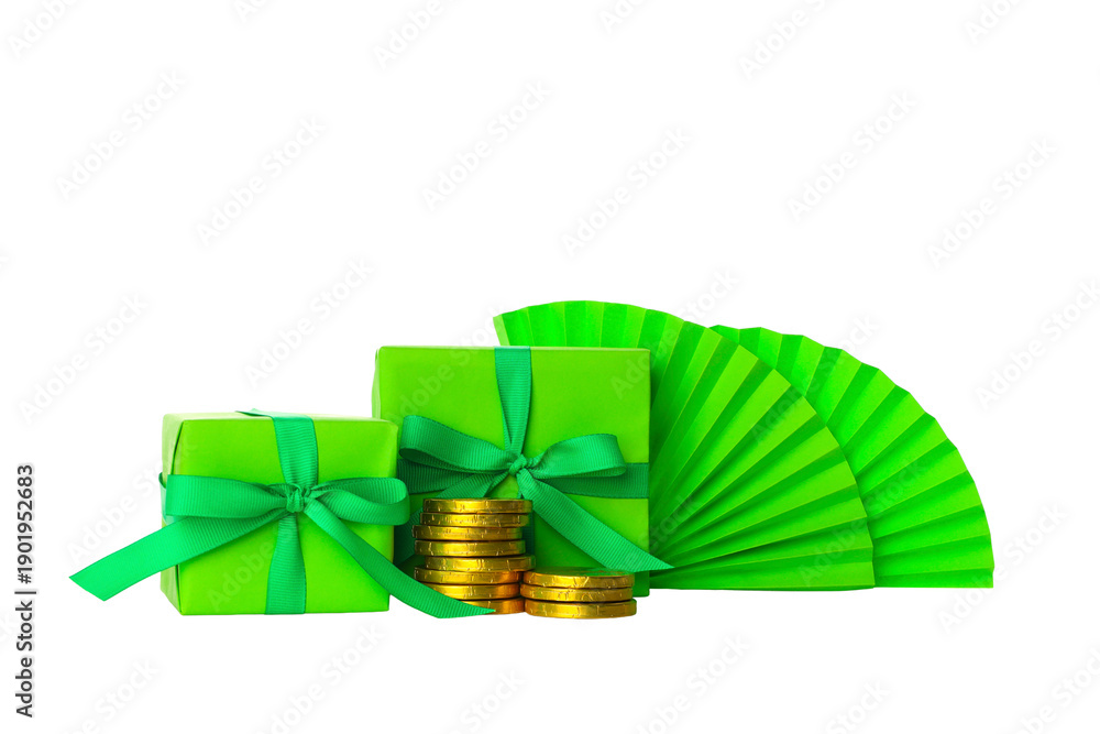 Naklejka premium Two green wrapped gifts and stacks of gold coins, isolated, PNG