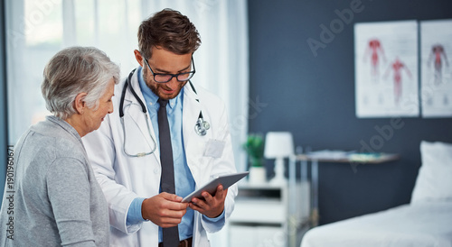 Photos Doctor, tablet and planning with old woman in hospital for advice, mammogram test results and healthcare