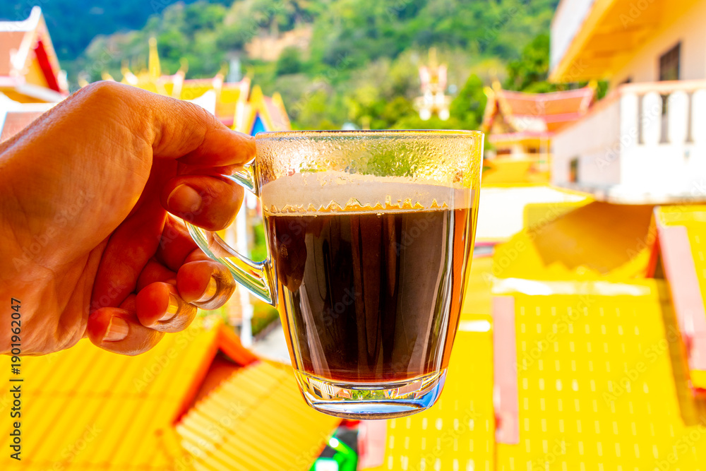 Fototapeta premium Black coffee tropical landscape terrace balcony temple panorama view Thailand.