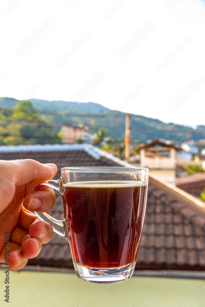 Fototapeta premium Black coffee with tropical landscape terrace balcony panorama view Thailand.