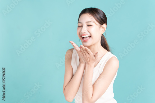 Wallpaper Mural Portrait of cheerful young asian woman with copy space on blue background. Torontodigital.ca