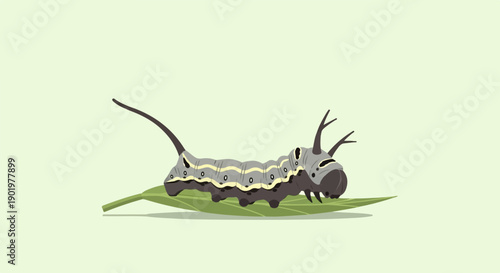 A stylized gray caterpillar with yellow stripes and dark horns on a green leaf