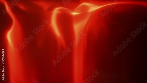 Macro view of fire recorded in slow motion with bright flames flowing over edges against a black background for compositing use.