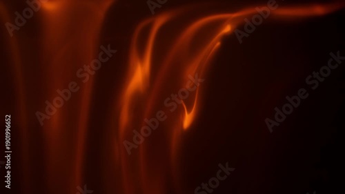 Close up slow motion footage of flames spreading across surfaces on a black background creating clean fire texture for design use.