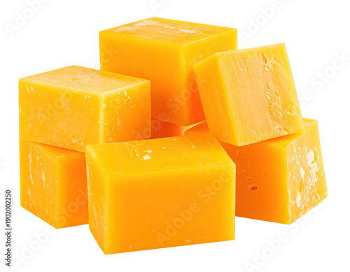Cubed, yellow dairy product arranged in a loose, appetizing pile