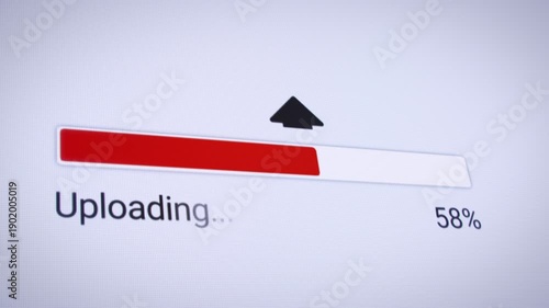 Video animation of the process of uploading file from the Internet on a computer monitor screen. A computer monitor displaying information about the data download in real time, including percentages.