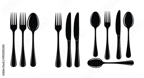 A collection of black silverware including forks spoons and knives presented as a silhouette on transparent background high quality professional detailed