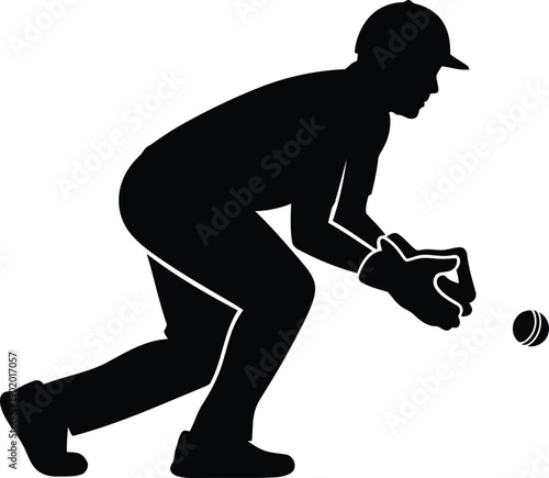 A baseball player in a crouching position catching a ball