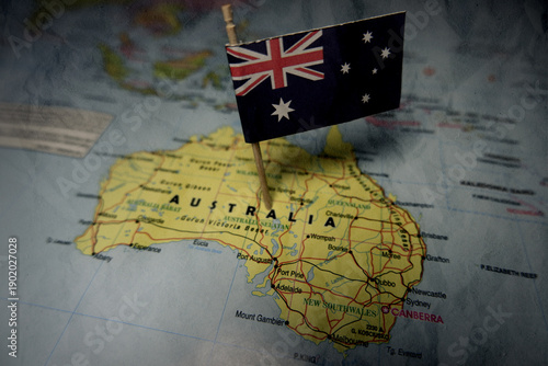 Australian national flag pinned on a world map highlighting Oceania geography and global connection