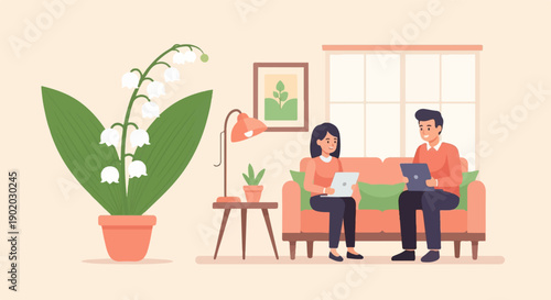 Couple relaxing on sofa with laptops and lily of the valley plant