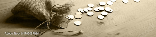 Фотография Silver coins in the bag