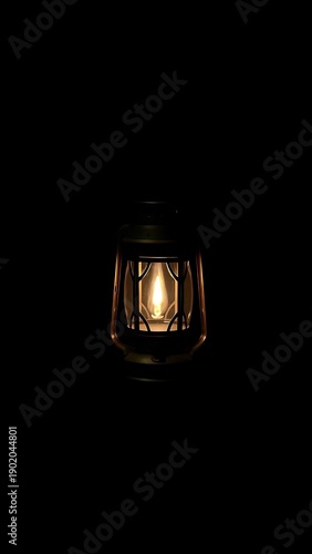 A Vintage Oil Lantern Glows Warmly in the Darkness, Evoking a Sense of Nostalgia and Cozy Ambiance