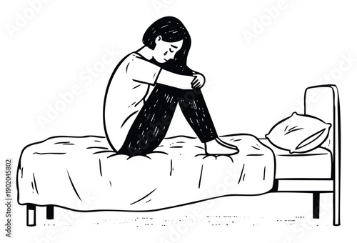 A person sitting sadly on a bed with knees drawn up and head down, crying, perfect for depicting feelings of sorrow, grief, loneliness, and mental health struggles in various media.