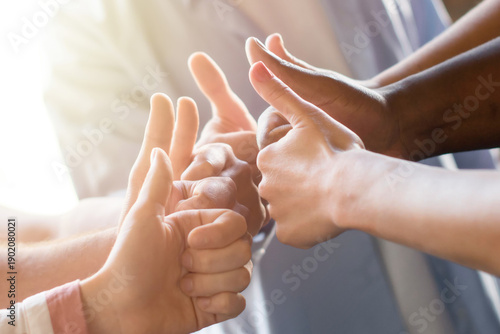 Quadro su tela Diverse team giving thumbs up together