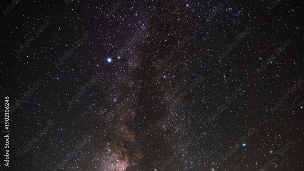 Fototapeta premium Milky way stars and constellations with a galaxy background photographed from a dark countryside location.