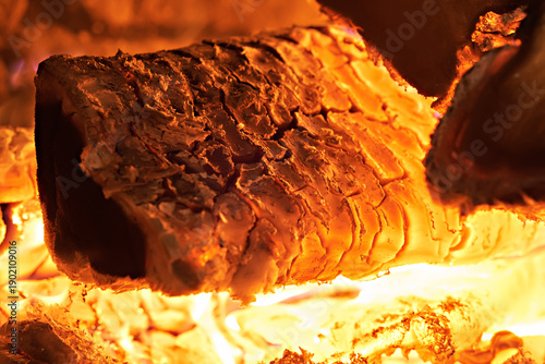 Close-up of a hearth. Wood burning in a rustic stove. Photo taken with a long exposure.