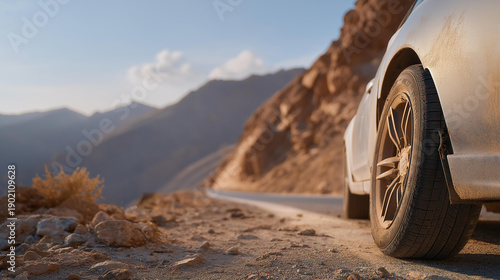 An abandoned vehicle on the side of the road with visibly flat tires, depicting the consequences of neglecting car tire pressure, highlighting the need for regular checks and maintenance. cinematic