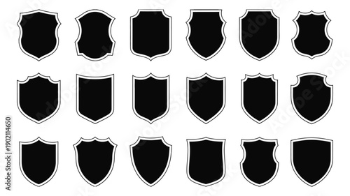 Black shield icon set, outlined heraldic emblems, protective graphic symbols, classic security badge illustrations, vector design elements.