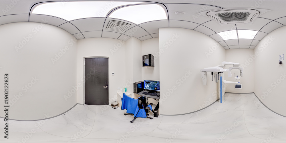 Fototapeta premium A clean 360 degree equirectangular view of a professional dental diagnostic room featuring a panoramic xray machine, medical computer desk, and sterile clinical interior.