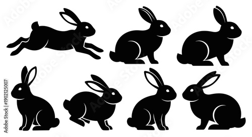 Collection of black silhouette illustrations of rabbits in various poses, including running and sitting.