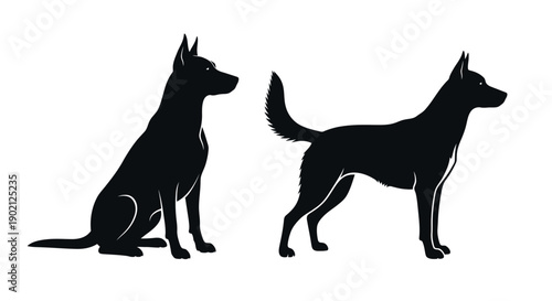 Two black silhouettes of dogs, one sitting and one standing, against a white background.