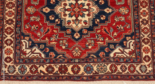 Intricate Persian rug with central medallion, floral borders, and fringe