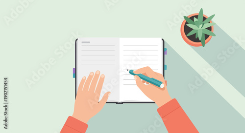 Hands writing in a notebook with a plant nearby